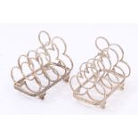 Pair early George V silver four-division toast racks with club-shaped frames and loop handles,