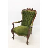 Early Victorian mahogany framed open armchair with green button velvet upholstered spoon-shaped