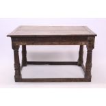 Oak refectory table, cleated plank top on gun barrel column supports united by foot stretchers,