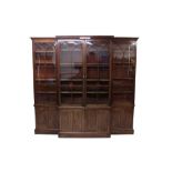 Good and rare George III mahogany and parquetry inlaid breakfront bookcase with tablet pendant drop