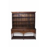18th century and later oak high dresser with boarded rack - the base having four long drawers,