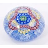 French Baccarat glass paperweight with millefiori patterns on upset muslin ground,