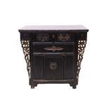 Antique Chinese ebonised cabinet with projecting top and bronze fittings,