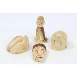 Four antique Inuit marine and possibly mammoth ivory carvings - including grotesque figural