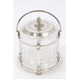 Victorian cut glass biscuit barrel in a silver plated swing-handled frame with turned columns and