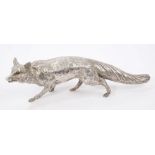 Contemporary silver figure of a fox with glass eyes,