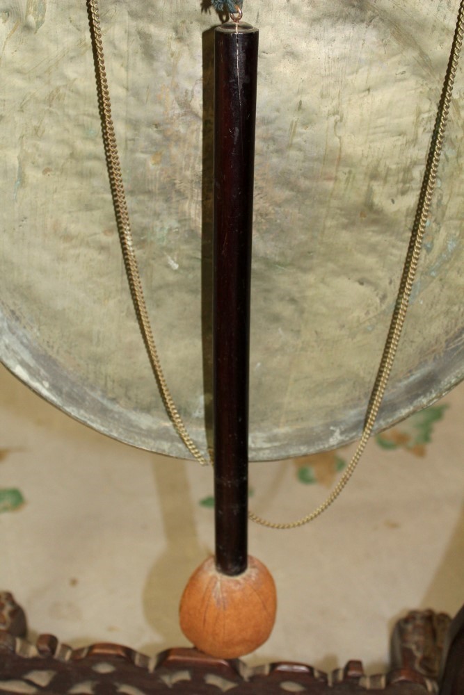 Late 19th / early 20th century Chinese carved hardwood gong stand with tooled metal gong and beater, - Image 11 of 12