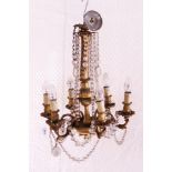 Early 20th century gilt metal six-branch electrolier with cut glass prismatic drops,