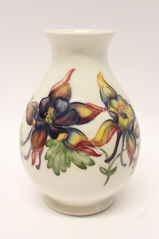 Moorcroft pottery vase decorated in the Columbine pattern on cream ground - impressed marks and