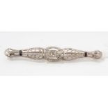 Art Deco-style platinum and gold (14k) bar brooch set with a single stone diamond to centre and two