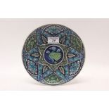 William De Morgan pottery plate decorated with Iznik-style decoration depicting a bird amongst