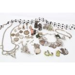 Group of costume jewellery - including a charm bracelet with various silver and other charms