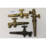 One box containing a quantity of antique brass barrel taps