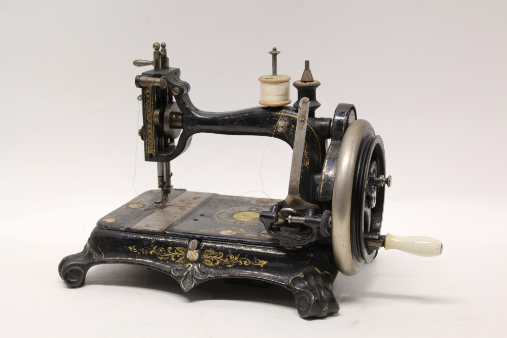Victorian Empress sewing machine with mother of pearl and gilded decoration,