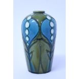 Minton Secessionist vase with tube-lined decoration, with white and blue panels on green ground,