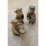 Schuco - three tinplate clockwork pigs playing violin,