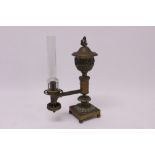 Victorian brass Argand lamp with urn reservoir, on a decorative base,