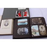 Postcards in two albums - including real photographic cards, greetings, romance, social history,