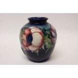 Moorcroft pottery vase decorated in the Anemone pattern on blue ground - impressed marks - Potter
