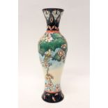 Moorcroft pottery vase decorated with flowers, bird and bees - impressed and painted marks to base,
