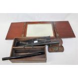 19th century campaign mirror in a mahogany case, three ebony rolling rules, a parallel ruler,