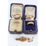 Victorian bar brooch and four gold rings - to include 18ct ruby and diamond ring (Birmingham 1919),