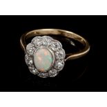 Opal and diamond cluster ring, the oval cabochon opal surrounded by ten old cut diamonds,