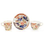 Early 19th century Chamberlains Worcester trio with boldly painted Imari palette floral decoration