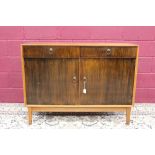 1970s Gordon Russell teak and walnut sideboard with two short drawers over pair of cupboards,