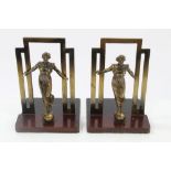 Pair of Art Deco bronze bookends, each with sinuous figure, on wooden plinth,