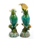 Pair late Victorian Minton Majolica cockatoo parrots on branches, with green, yellow and blue glaze,