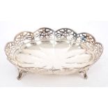 1920s silver dish of lobed oval form, with pierced border, on four scroll feet (London 1925),