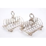 Matched pair of George IV / Victorian silver six-division toast racks with looped frames,