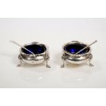 Pair Victorian silver cauldron salts with blue glass liners,