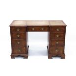 18th century-style walnut crossbanded kneehole desk with leather inset top and nine graduated