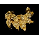 1960s Kutchinsky 18ct gold brooch with a stylised foliate spray of textured gold leaves, signed,