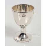 1920s silver egg cup of conventional form, with decorative chain border and engraved initials,