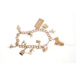 Gold charm bracelet with eleven 9ct gold charms CONDITION REPORT Total gross weight
