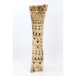 Large Old African, possibly Nigerian carved elephant bone decorated with human figures and masks,