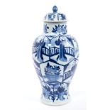 Late 17th century Chinese Kangxi blue and white vase and cover with segmented figure and vase of