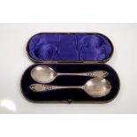 Pair Edwardian silver spoons with large circular bowls and floral pierced and engraved stems,