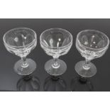 Nine Victorian champagne coupe glasses with slice-cut decoration and other Victorian wine glasses