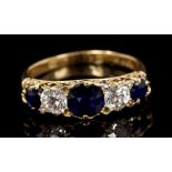 Victorian sapphire and diamond five stone ring with three round mixed cut blue sapphires and two