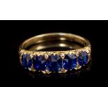 Victorian sapphire ring with five oval mixed cut blue sapphires with rose cut diamond accents to