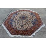 Good quality Tabriz-style octagonal rug with central medallion and scrolling lotus ornament on