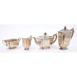 Fine quality George V four piece silver tea set - comprising teapot of shaped rectangular form,
