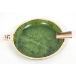 Fine Cartier New York gold and enamel mounted green spinach jade ashtray with blue enamel Swastika