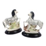 Pair Victorian Staffordshire pottery figures of zebras on naturalistic bases with custom-made