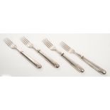 Four Victorian silver fish forks with silver handles and blades, engraved crests,