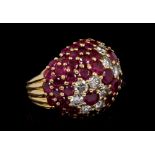 1960s Kutchinsky 18ct gold diamond and ruby cocktail ring of bombe form with two flower-head